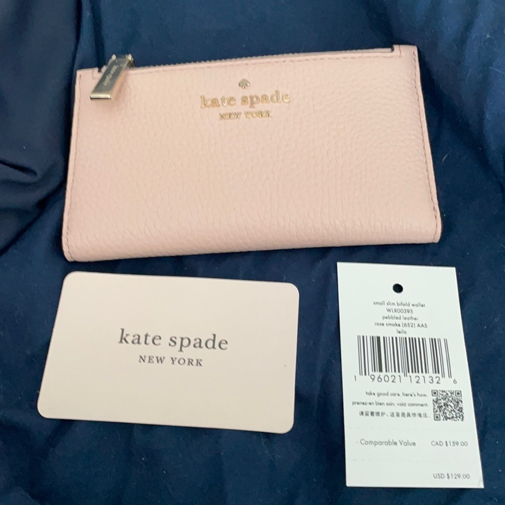 Kate Spade bifold wallet medium size in smoke rose. Brand new